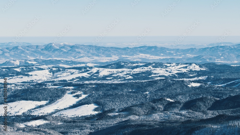 snowy mountains - Light snowfall with winds. Cloudy Sky . High quality photo