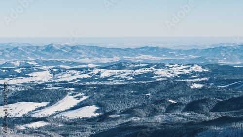 snowy mountains - Light snowfall with winds. Cloudy Sky . High quality photo