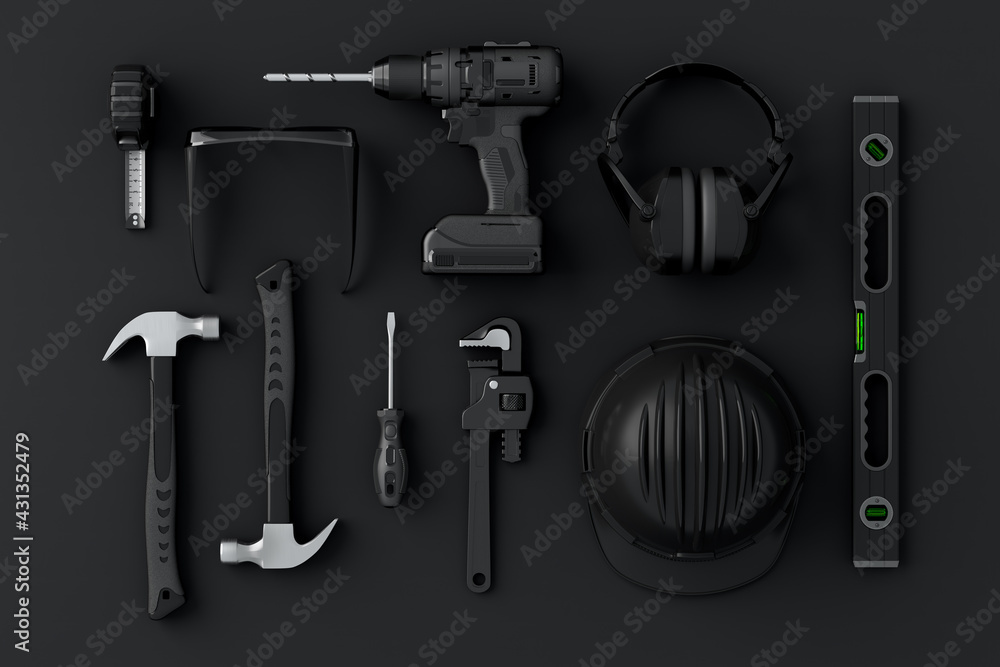 Fototapeta premium Top view of monochrome construction tools for repair and installation on black