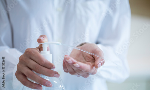 women washing hands with alcohol gel or antibacterial soap sanitizer after using a public restroom.Hygiene concept. prevent the spread of germs and bacteria and avoid infections corona virus 