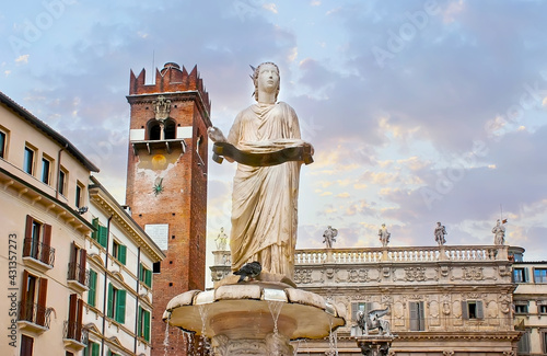 The ancient sculpture of Madonna Verona Fountain, Piazza Erbe square, Verona, Italy