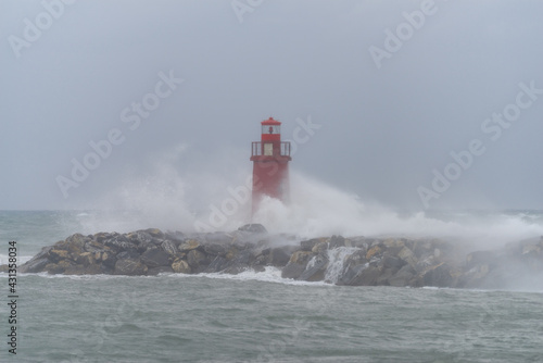 Storm waves striking the Imperia harbour breakwater, Italy