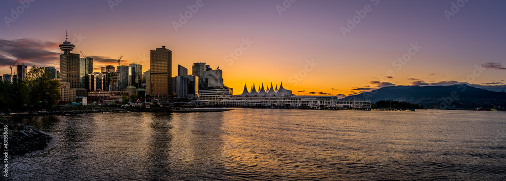 Panorama View of Sunset over the Harbor and the Sails of Canada Place, the Cruise Ship Terminal and Convention Center on the Waterfront of Vancouver, British Columbia, Canada