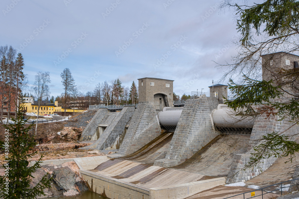 View of the hydroelectric powerplant dam in spring, Imatrankoski rapid (The Imatra Rapid), Vuoksi River, Imatra, Finland View of the hydroelectric powerplant dam in spring, Imatrankoski rapid (The Imatra Rapid), Vuoksi River, Imatra, Finland
