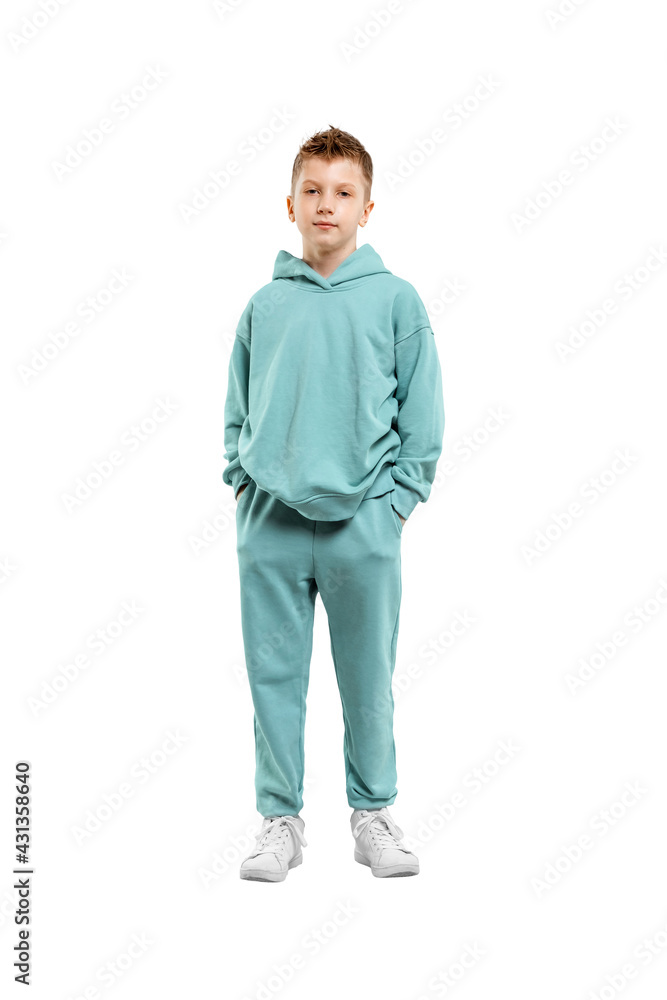 Fototapeta premium Handsome boy in blue suit isolated on white background. Studio portrait of a child.
