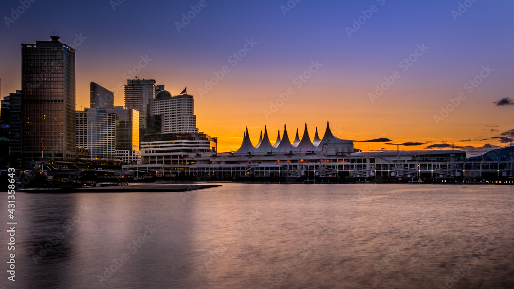 Sunset over the Harbor and the Sails of Canada Place, the Cruise Ship Terminal and Convention Center on the Waterfront of Vancouver, British Columbia, Canada