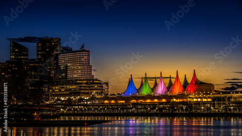 Blue Hour after the Sun has set over the Harbor and the Colorful Sails of Canada Place, the Cruise Ship Terminal and Convention Center on the Waterfront of Vancouver, British Columbia, Canada photo