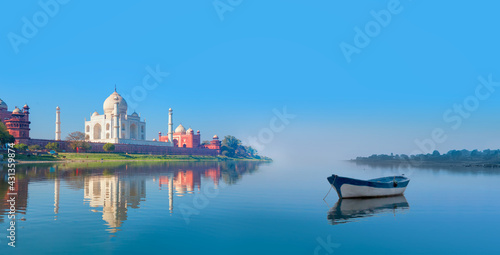 Fototapeta Naklejka Na Ścianę i Meble -  Panoramic view of Taj Mahal reflected in Yamuna river - Agra , Uttar Pradesh, India