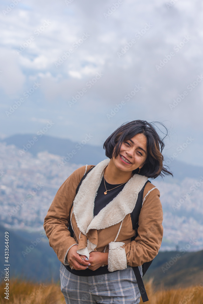 Young woman walking along a mountain path. Young woman walking along a mountain path.