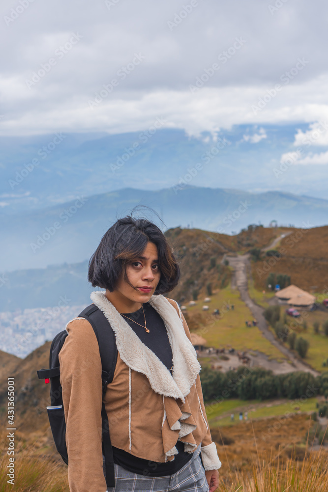 Naklejka premium Young woman walking along a mountain path.
