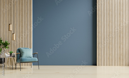 Fotografie, Obraz Stylish Modern wooden living room has an armchair on empty dark blue wall background