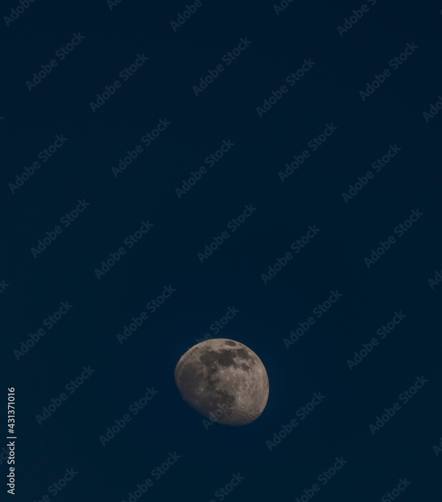 White moon with dark blue sky in Krkonose mountains in spring evening White moon with dark blue sky in Krkonose mountains in spring evening