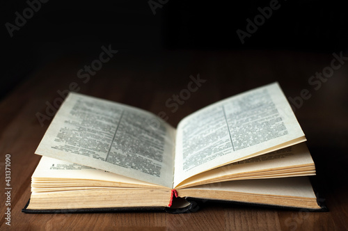 Open book. Open Bible. On a wooden table. Reading. Scripture.