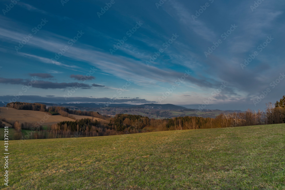 Sunset view in Roprachtice village in Krkonose mountains with color sky Sunset view in Roprachtice village in Krkonose mountains with color sky