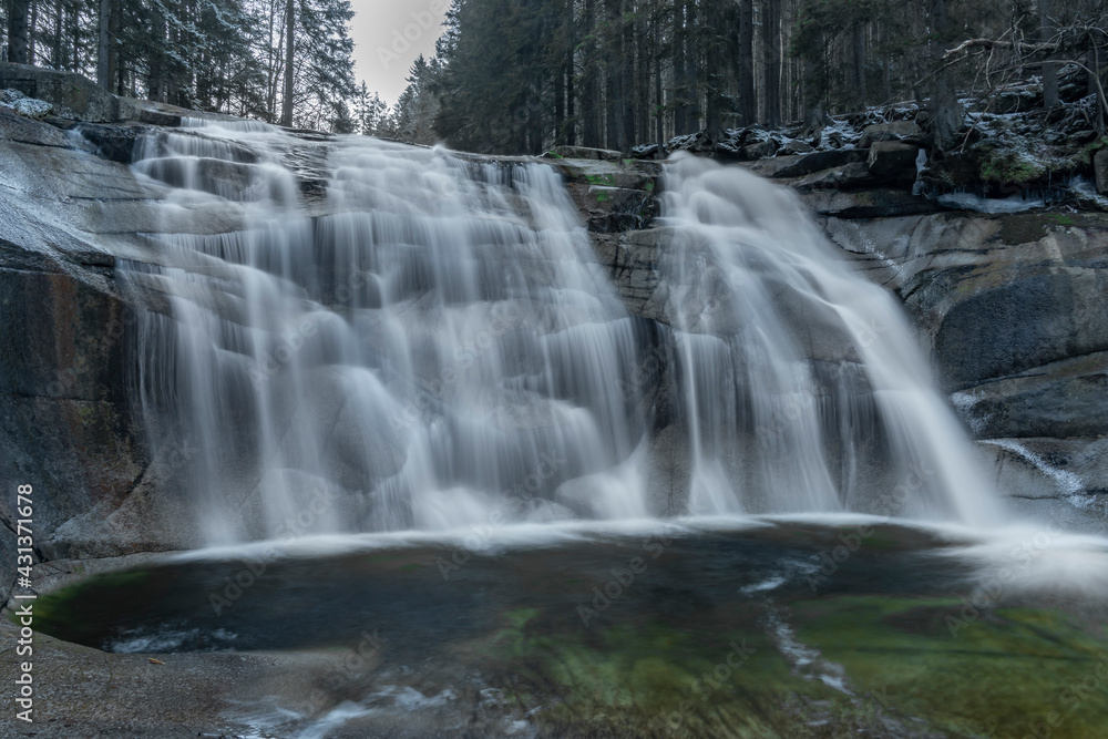 Fototapeta premium Cold morning with Mumlavske waterfalls near Harrachov town in Krkonose mountains