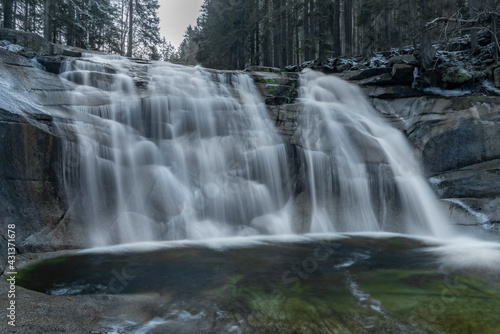 Cold morning with Mumlavske waterfalls near Harrachov town in Krkonose mountains