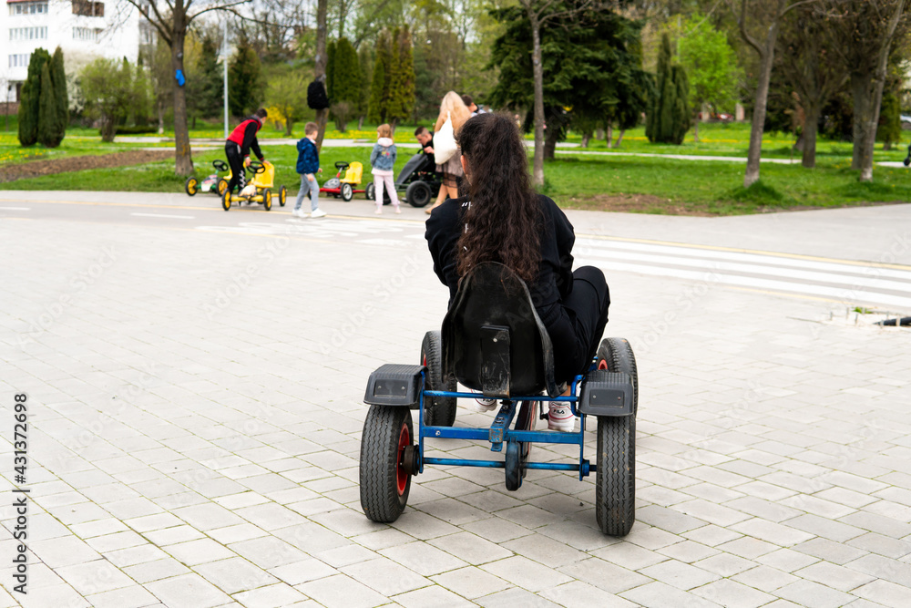 girl rides a bicycle in the park girl rides a bicycle in the park