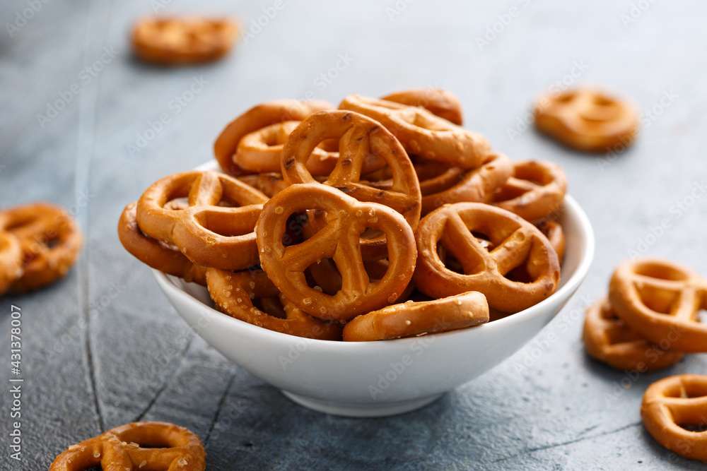 Salted pretzels snack for party in white bowl Salted pretzels snack for party in white bowl