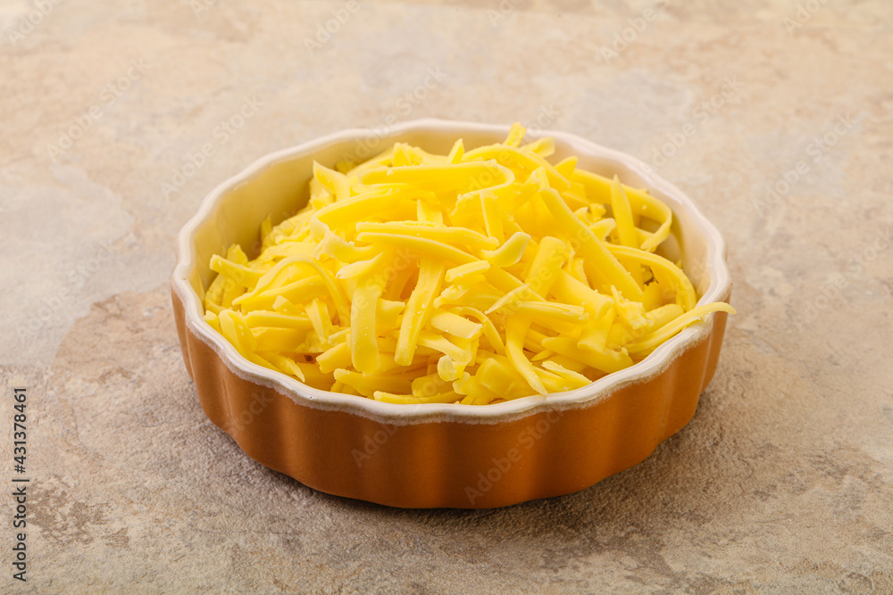 Shredded yellow cheese in the bowl Shredded yellow cheese in the bowl