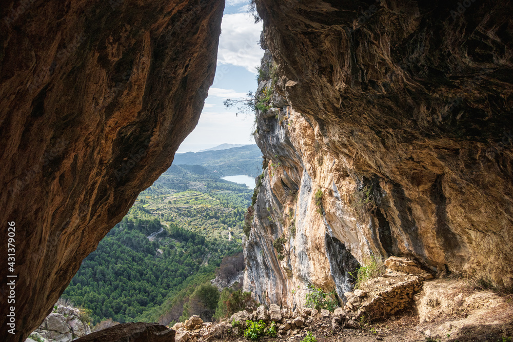 Views of a mountainous landscape from inside a cave, in the province of Alicante (Spain).