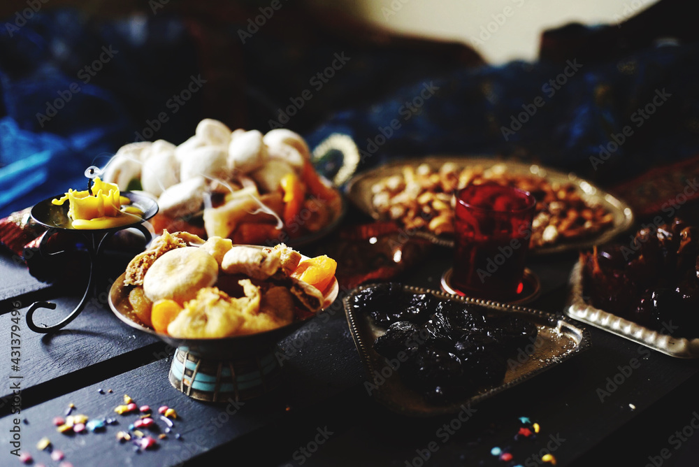 Eastern table. Dried fruits. Mix of nuts, dried apricots, Turkish delight, dates, figs, sweets. Eastern table. Dried fruits. Mix of nuts, dried apricots, Turkish delight, dates, figs, sweets.