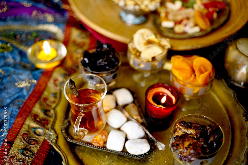 Eastern table. Dried fruits. Mix of nuts, dried apricots, Turkish delight, dates, figs, sweets. 