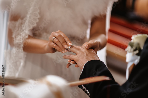 bride and groom holding hands