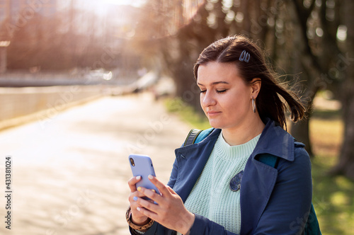 young girl uses a mobile. girl's telephone correspondence