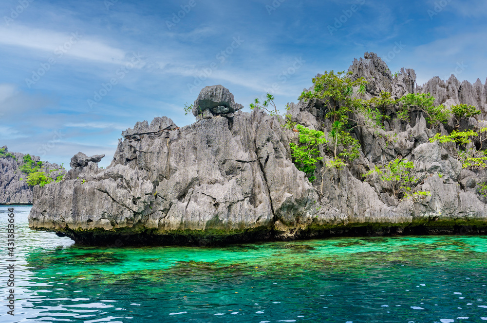 Twin Lagoon on paradise island with sharp limestone rocks, tropical travel destination - Coron, Palawan, Philippines. Twin Lagoon on paradise island with sharp limestone rocks, tropical travel destination - Coron, Palawan, Philippines.