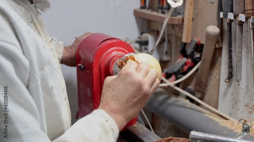 Cabinetmaker polishing and polishing piece of wood