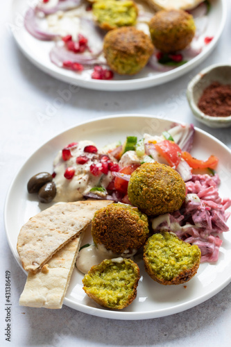 Middle eastern spread with falafel, olives and beetroot salad