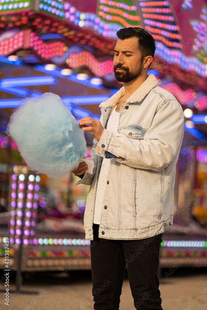 Guy eating cotton candy