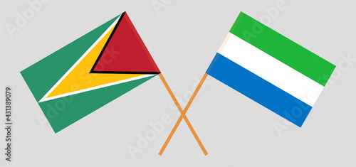 Crossed flags of Guyana and Sierra Leone. Official colors. Correct proportion