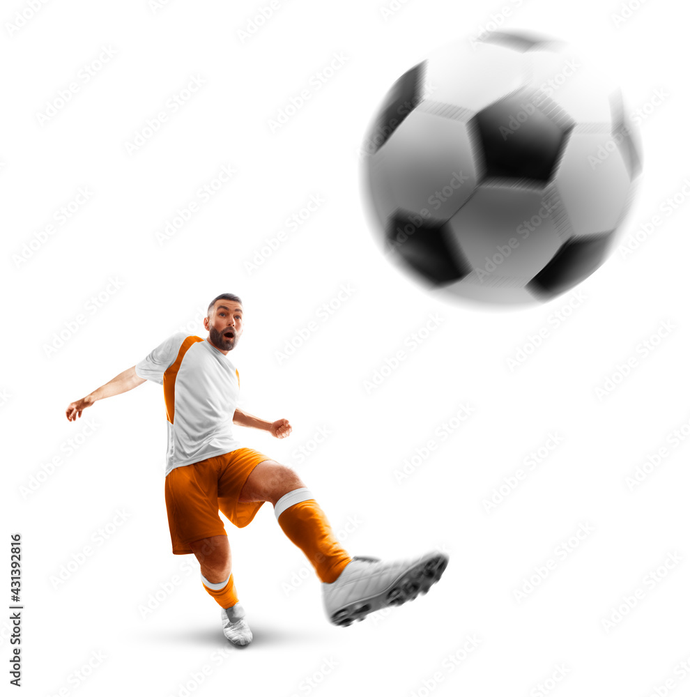 Power soccer kick. A soccer player kicks the ball. Professional soccer player in action. Isolated