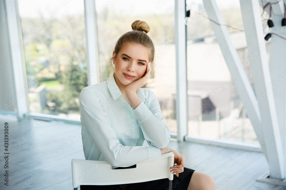 Portrait of a beautiful young businesswoman in the office. Successful woman Portrait of a beautiful young businesswoman in the office. Successful woman