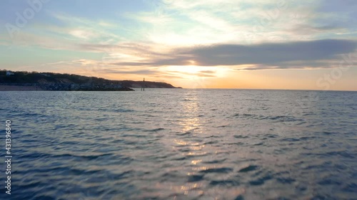 Beach sunset ocean water with land bed