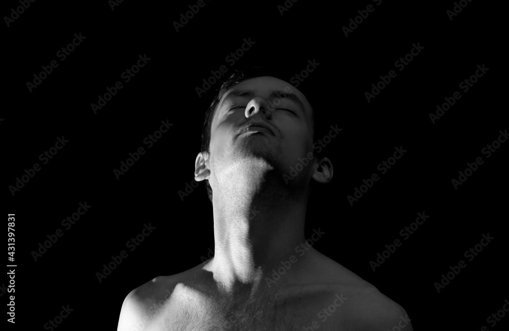 black and white photo portrait of a guy, in dramatic lighting black and white photo portrait of a guy, in dramatic lighting