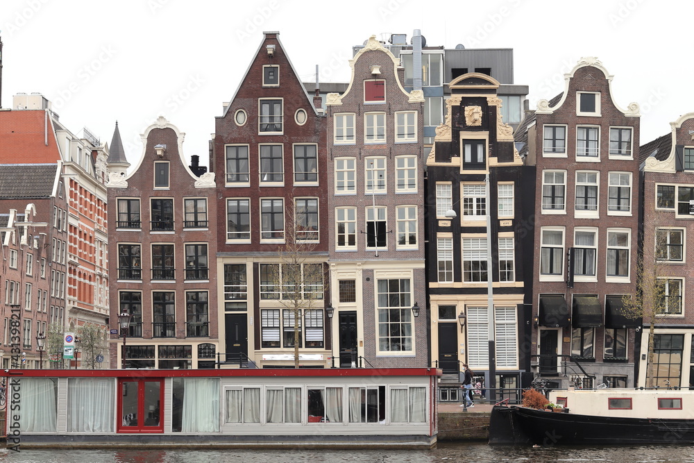 Amsterdam Amstel River View with Historical House Facades and Houseboats