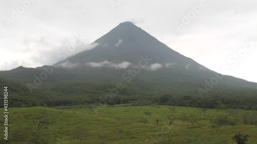 View of Arenal region in the morning, with mist over the green, lush forest and birds chirping