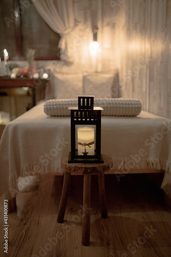 Candlestvick in front of the bed