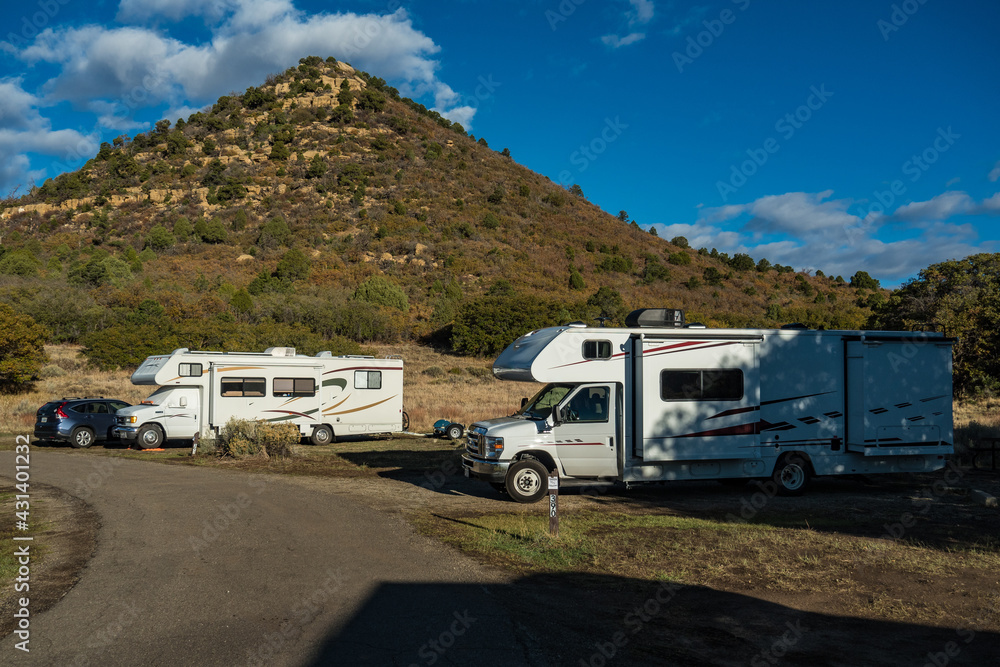 C-type camper with slideouts standing in a wilderness campground in the mountains of the Mesa Verde National Park