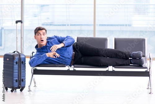 Man wairing to boarding in airport lounge room photo