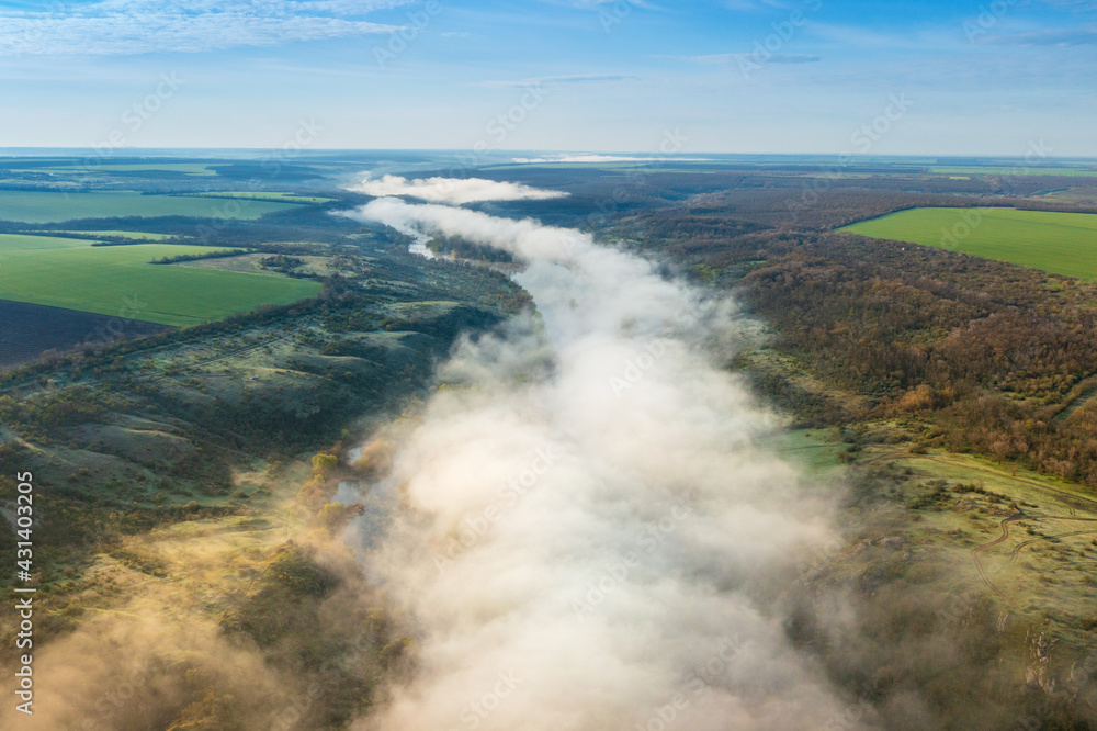 wide angle aerial view to the landascape withfog tails about river in morning time wide angle aerial view to the landascape withfog tails about river in morning time