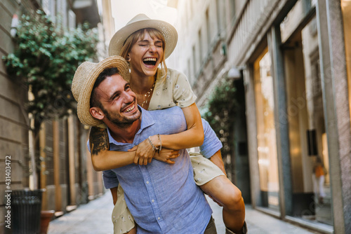 Photography Couple of tourists having fun walking on city street at holiday - Happy friends