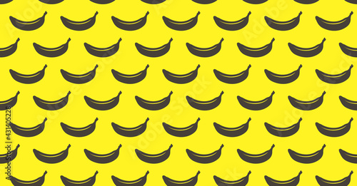 Endless seamless pattern with gray ripe bananas on a yellow background. Wallpaper with windy bananas.