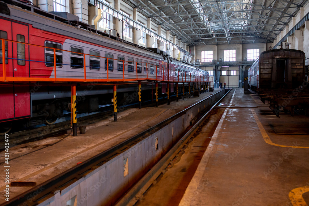 Summer, 2017 - Ussuriysk, Russia - Ussuriysk locomotive repair plant. Passenger cars are being repaired in a large workshop.