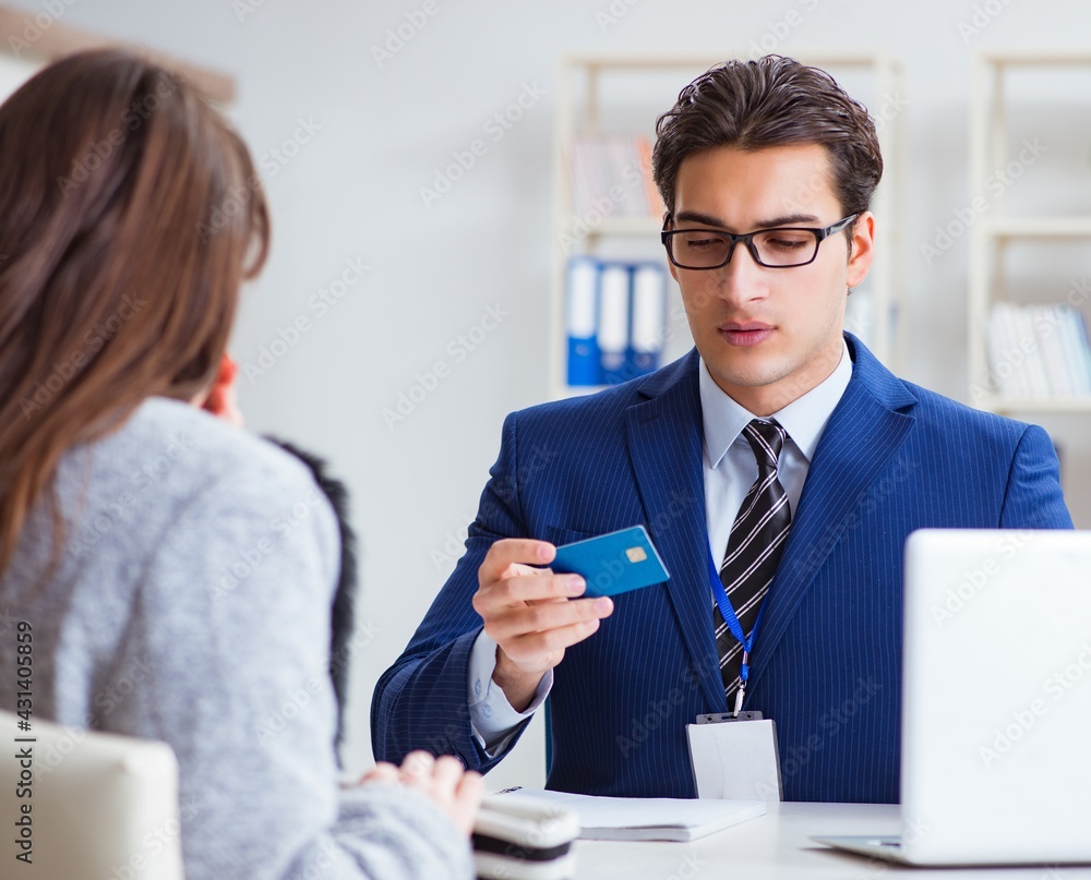 Woman makes payment with credit card Woman makes payment with credit card