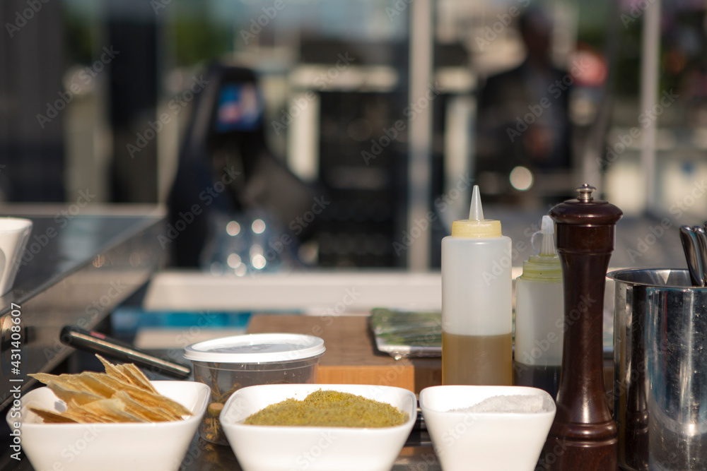 Baking utensils, spices and food ingredients ready in open kitchen. Brussels, Belgium