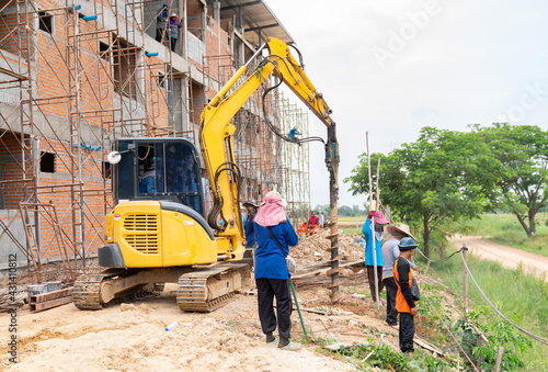 Drill excavator digger for burying fence posts.