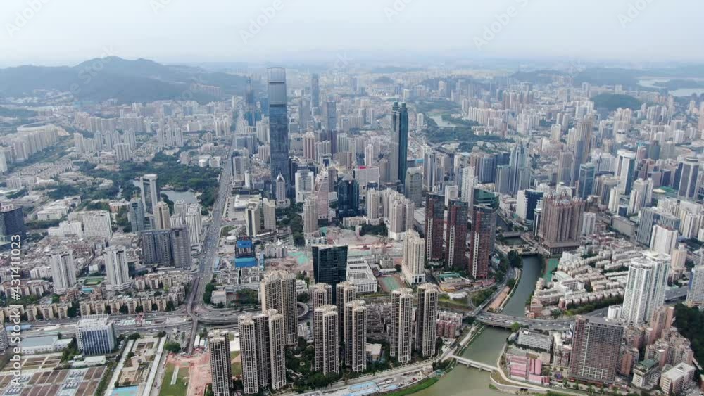 Aerial view over Shenzhen cityscape with massive urban development and skyscrapers. Aerial view over Shenzhen cityscape with massive urban development and skyscrapers.